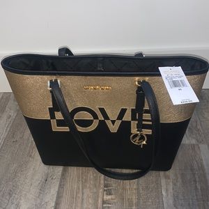 MK handbag black and gold